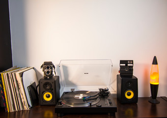 Music set with vinyl, speakers, record players, lava lamp and vintage cameras horizontal