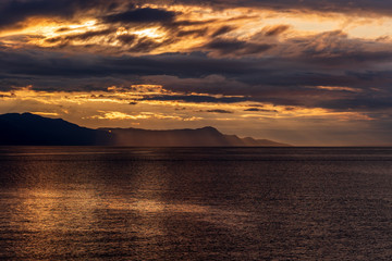 Fototapeta premium Ocean sunset over mountains in beautiful British Columbia. Canada.