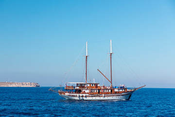Yachts and sailing boats on the Aegean Sea in the Greek Islands near Santorini Island