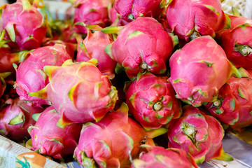 Obraz na płótnie Canvas Dragon fruit on market stand, Thailand