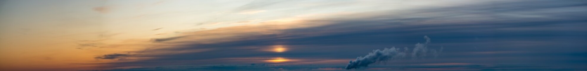 Fantastic clouds against blue sky, panorama