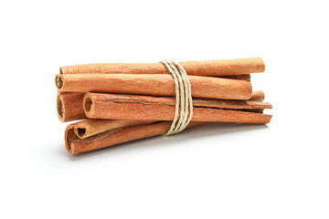 Tied cinnamon sticks isolated on white background. Sweet spice