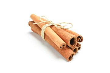 Tied cinnamon sticks isolated on white background. Sweet spice