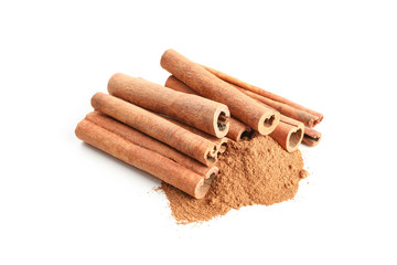 Cinnamon sticks and powder isolated on white background. Sweet spice