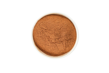 Bowl with cinnamon powder isolated on white background, close up