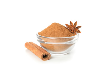 Cinnamon stick and sauceboat with powder isolated on white background