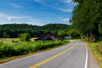An old wood barn along a country road in rural Tennessee, USA