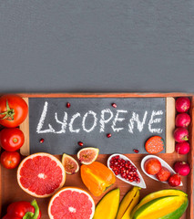 Fruits and vegetables containing lycopene. Healthy vegan food background. Lycopene is a red...
