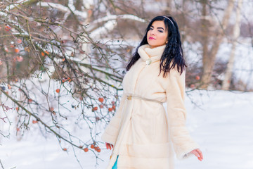 Christmas or New Year Holidays, magical atmosphere and pretty woman at snowy day. Inspiration and winter idea 