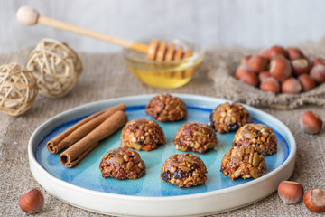Energy and healthy sweets made from cereals, quinoa, dried nuts, seeds, dried fruits and honey. Cereal crunchy sweet snacks. Homemade useful candies. Raw and vegan sweets.
