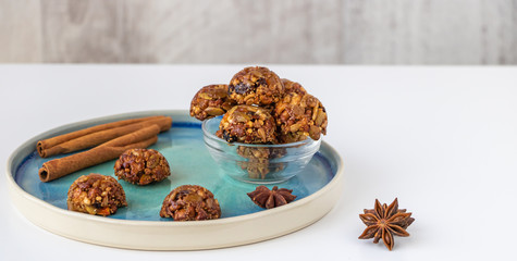 Energy and healthy sweets made from cereals, quinoa, dried nuts, seeds, dried fruits and honey. Cereal crunchy sweet snacks. Homemade useful candies. Raw and vegan sweets.