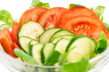 Fresh green salad made of tomatoes, cucumbers and salad. Healthy food concept.