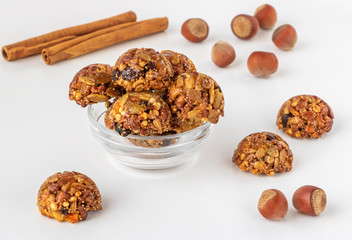 Energy and healthy sweets made from cereals, quinoa, dried nuts, seeds, dried fruits and honey. Cereal crunchy sweet snacks. Homemade useful candies. Raw and vegan sweets.