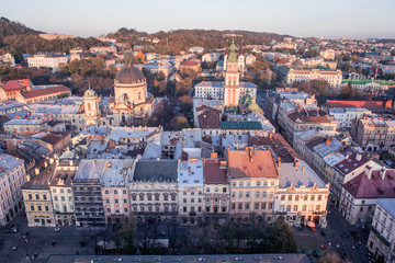 Lviv, Ukraine - October 24, 2019: Beautiful Ratusha view of the Dominican Cathedral, the Assumption Church and the historic center of Lviv, Ukraine, on a sunny evening. Roofs and streets