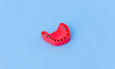 model of human gums without teeth isolated on blue
