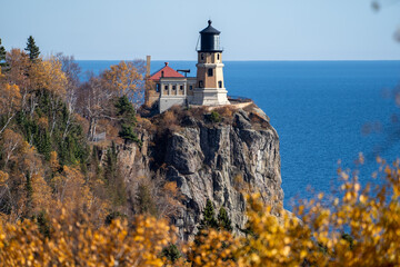 Natural framing of Split Rock Lighthouse on the North Shore of Minnesota, framed by fall leaves