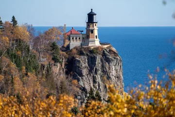 Foto op Canvas Natural framing of Split Rock Lighthouse on the North Shore of Minnesota, framed by fall leaves © MelissaMN