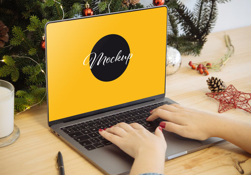 Laptop Mockup with Hands and Christmas Decoration