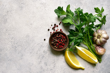 Assortment of spices : garlic, parsley and kind of pepper. Top view with copy space.