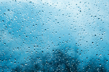 Beautiful sky and clouds, rain, wet glass, drops of water on the glass, drops of water on the window, drops