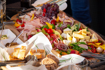 Food plate with cheese, union, bread, meat, ham, champion, vegetables