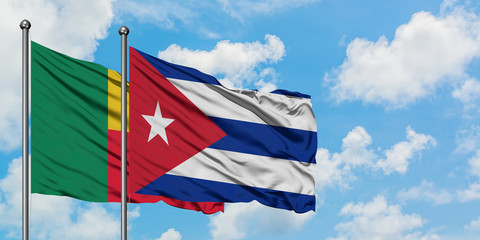 Benin and Cuba flag waving in the wind against white cloudy blue sky together. Diplomacy concept, international relations.