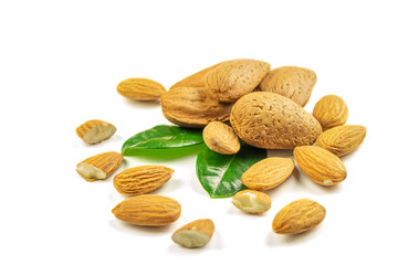Group of peeled and unpeeled ripe dry almonds on the white background, closeup, isolated.