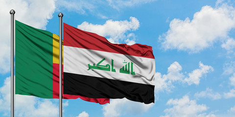 Benin and Iraq flag waving in the wind against white cloudy blue sky together. Diplomacy concept, international relations.
