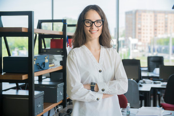 portrait young beautiful successful businesswoman in office 