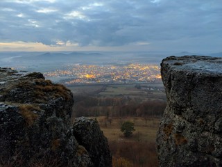 View from top of mountain down to city in valley