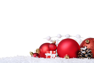 Christmas balls with gift box and cone on white background