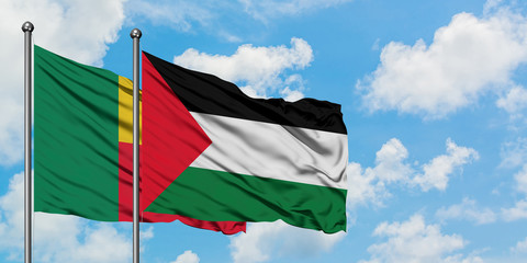 Benin and Palestine flag waving in the wind against white cloudy blue sky together. Diplomacy concept, international relations.