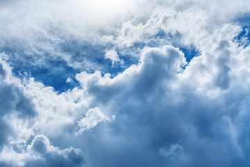 Colorful dramatic blue sky background with white clouds