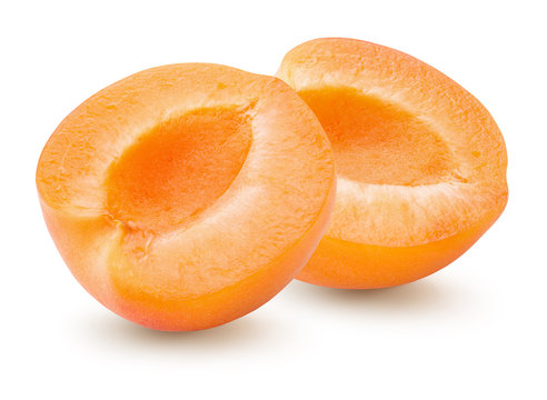 two halves of apricot isolated on a white background