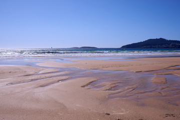 Fototapeta na wymiar Empty beach with low tide in Playa America near Vigo, Galicia