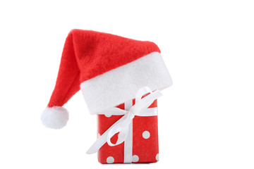 Red santa hat with gift box isolated on white background