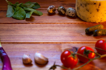 Vegetables and cheese on a rustic wooden board. Organic healthy foods Healthy food concept.