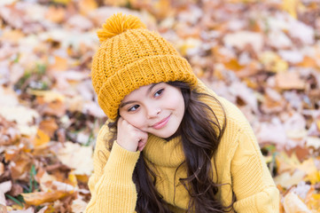 Warm autumn mood. Small child in good mood outdoors. Little child relax on fresh air on autumn day. Thoughtful mood. Fall mood is on