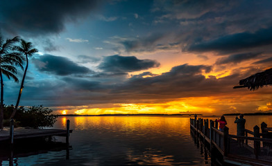 Fototapeta premium Spectacular sunset at Islamorada in the Florida Keys. The sun comes out just after a storm and lights up the sky with beautiful colors