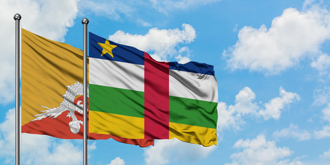 Bhutan and Central African Republic flag waving in the wind against white cloudy blue sky together. Diplomacy concept, international relations.