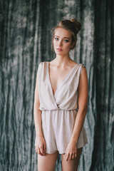 Fototapeta premium Young beautiful woman posing in a studio.