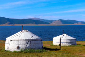 Mongolian gers at Black Lake on a sunny day