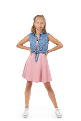 Fototapeta premium Beautiful young girl in fashion clothing isolated on white background