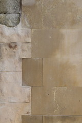 Structure of an old wall painted with a plaster and marble fragment