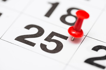 Pin on the date number 25. The twenty fifth day of the month is marked with a red thumbtack. Pin on...