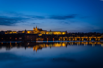 Night view of Prague at blue hour with the lights reflected on the Moldava river, Prague, Czech Republic