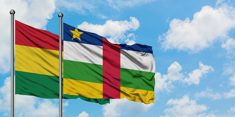 Bolivia and Central African Republic flag waving in the wind against white cloudy blue sky together. Diplomacy concept, international relations.