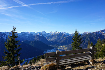 bench overlooking a mountain scenery