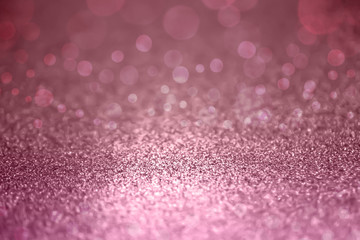 Pink glitter lights with bokeh background. Defocused shimmering background.