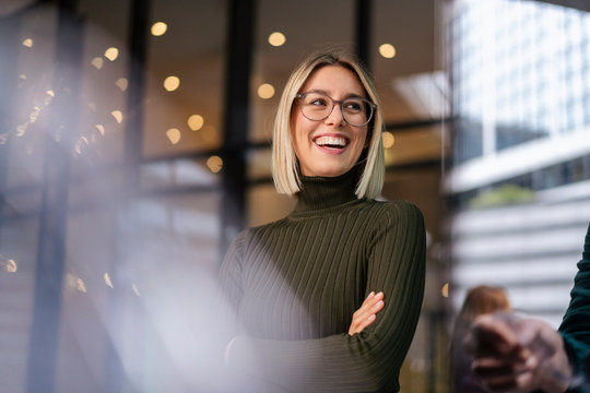 Portrait of happy young woman in the city